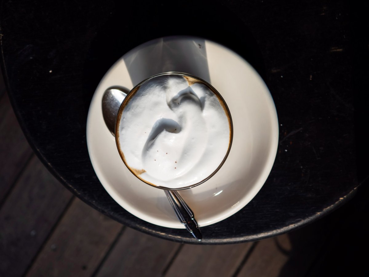 Layered espresso drink served in a clear glass